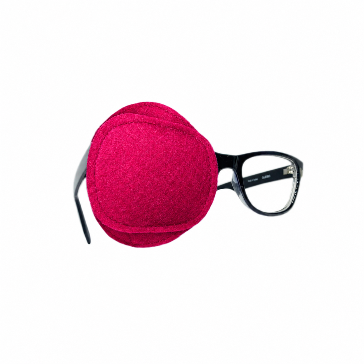 Solid pink wool felt eye patch for glasses shown on and off frame