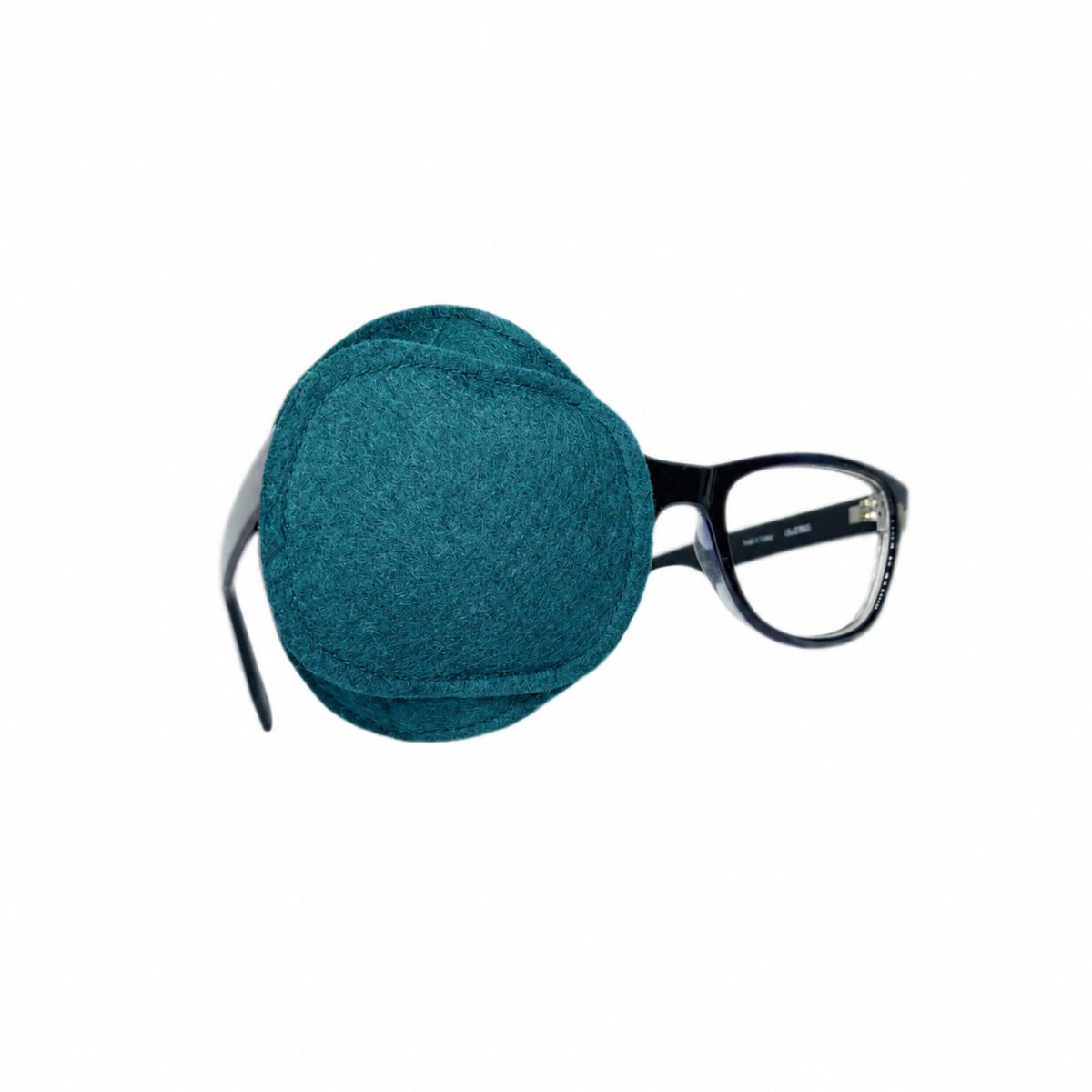 Solid teal wool felt eye patch on glasses frame and close-up view